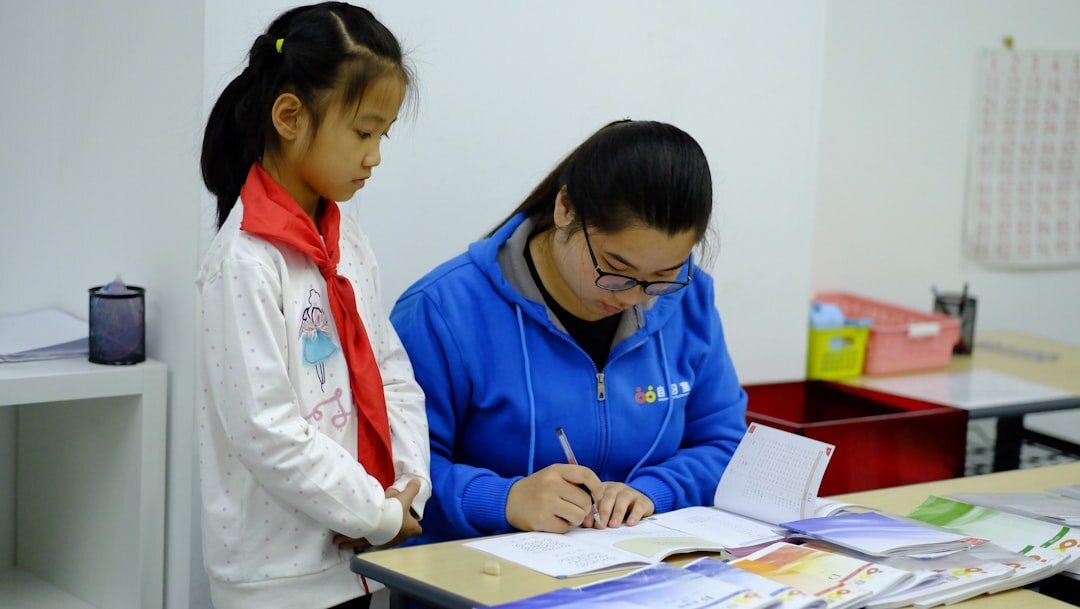 Two colleagues coordinating tasks using printed charts